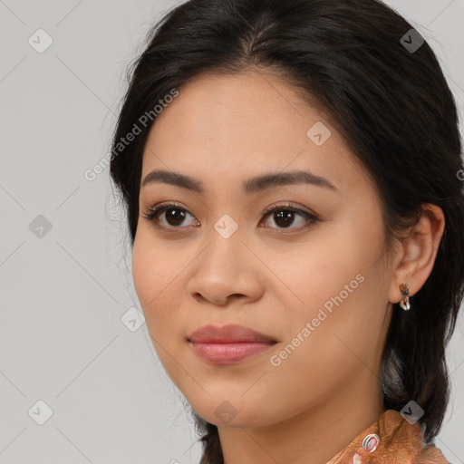 Joyful latino young-adult female with long  brown hair and brown eyes