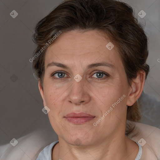 Joyful white adult female with short  brown hair and brown eyes