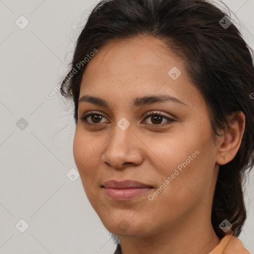 Joyful latino young-adult female with medium  brown hair and brown eyes