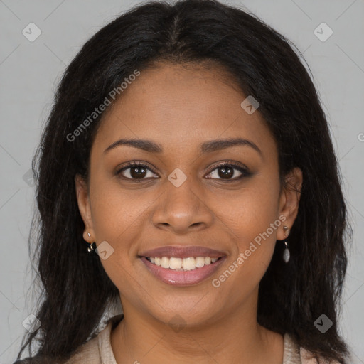 Joyful black young-adult female with long  brown hair and brown eyes