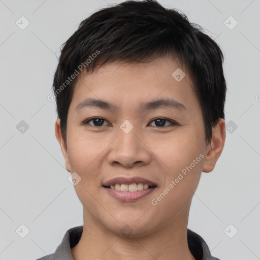 Joyful asian young-adult male with short  black hair and brown eyes