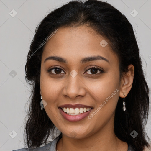 Joyful latino young-adult female with long  brown hair and brown eyes