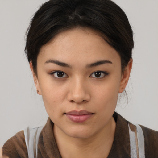 Neutral asian young-adult female with medium  brown hair and brown eyes