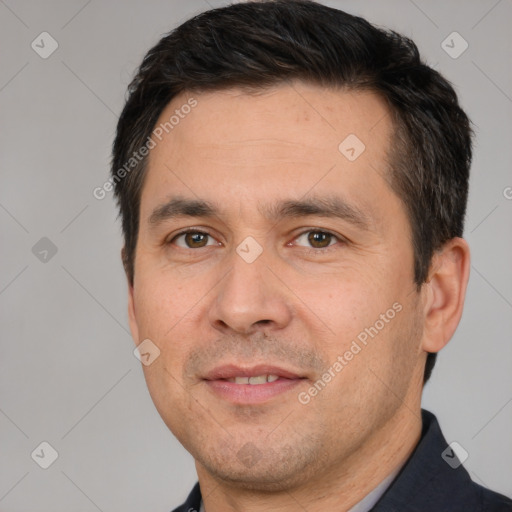 Joyful white adult male with short  brown hair and brown eyes