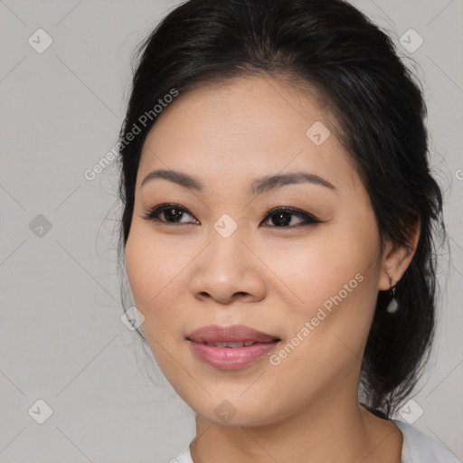 Joyful asian young-adult female with medium  brown hair and brown eyes