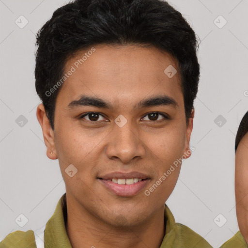 Joyful latino young-adult male with short  brown hair and brown eyes