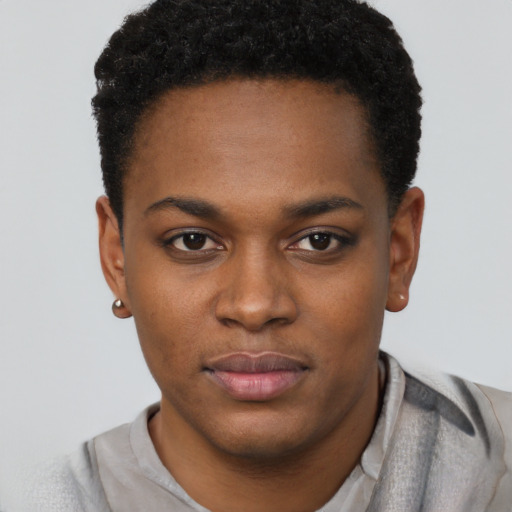 Joyful black young-adult female with short  black hair and brown eyes