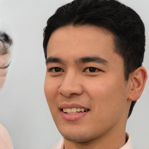 Joyful white young-adult male with short  black hair and brown eyes