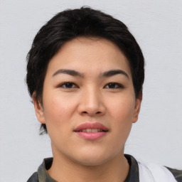 Joyful asian young-adult female with short  brown hair and brown eyes