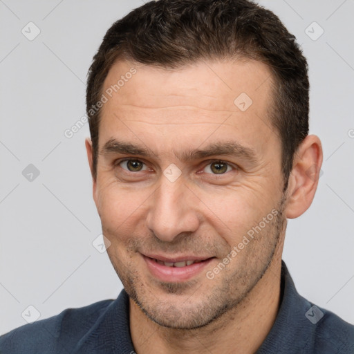 Joyful white adult male with short  brown hair and brown eyes