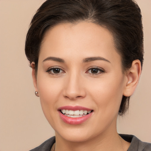 Joyful white young-adult female with medium  brown hair and brown eyes