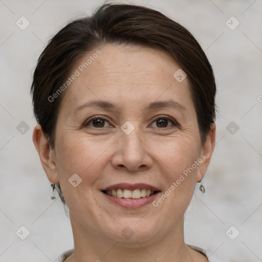 Joyful white adult female with short  brown hair and brown eyes