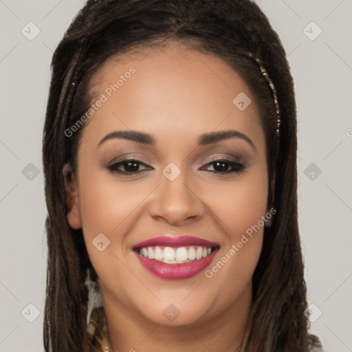 Joyful latino young-adult female with long  brown hair and brown eyes