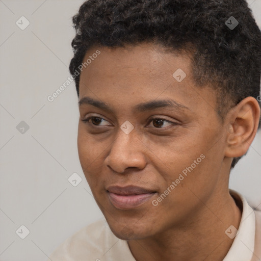 Joyful black young-adult male with short  black hair and brown eyes