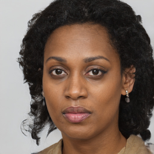 Neutral black young-adult female with long  black hair and brown eyes