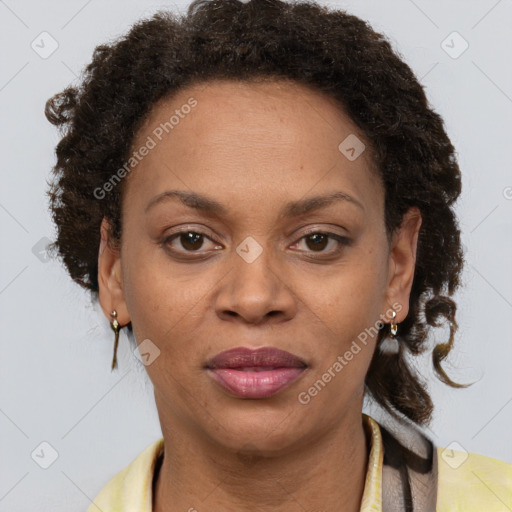 Joyful black adult female with short  brown hair and brown eyes