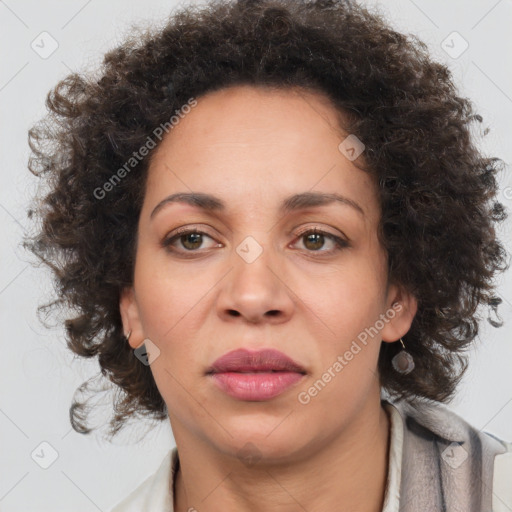 Joyful black adult female with medium  brown hair and brown eyes