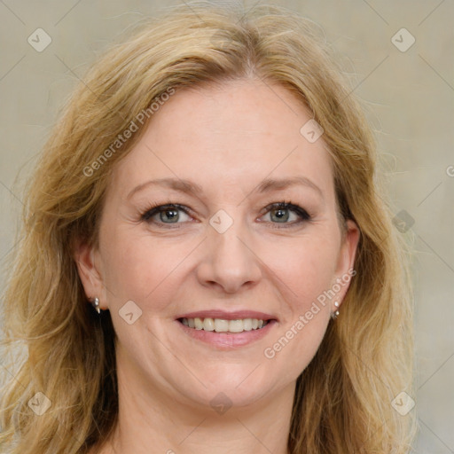 Joyful white adult female with long  brown hair and brown eyes