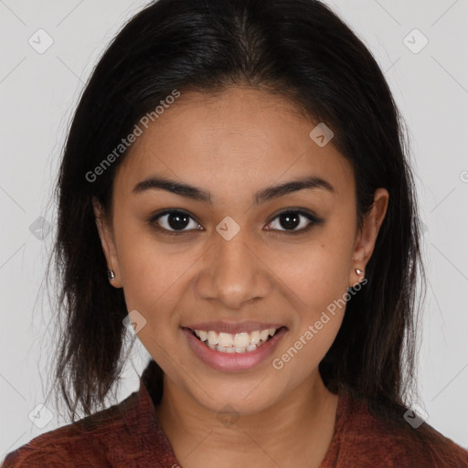 Joyful latino young-adult female with long  brown hair and brown eyes