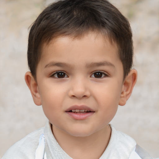 Joyful white child male with short  brown hair and brown eyes