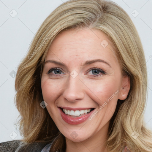 Joyful white young-adult female with medium  brown hair and blue eyes