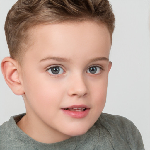 Joyful white child female with short  brown hair and grey eyes