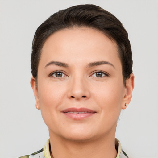 Joyful white young-adult female with short  brown hair and brown eyes