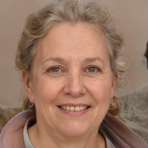 Joyful white middle-aged female with medium  brown hair and brown eyes