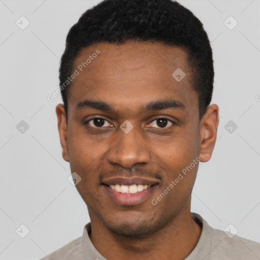 Joyful black young-adult male with short  black hair and brown eyes