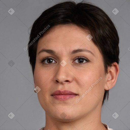 Joyful white adult female with short  brown hair and brown eyes