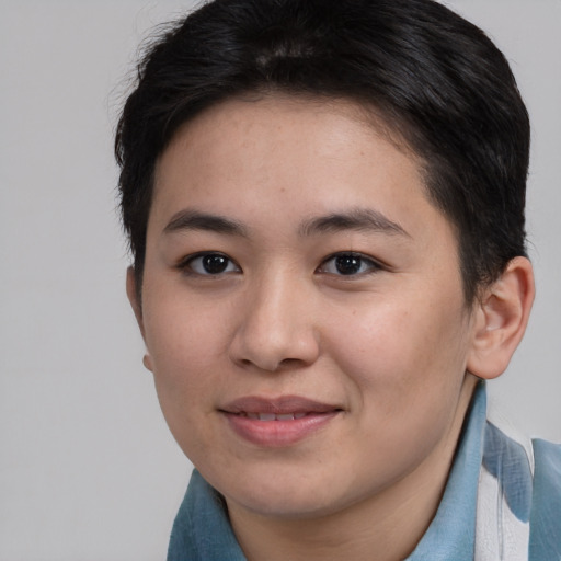 Joyful asian young-adult female with short  brown hair and brown eyes