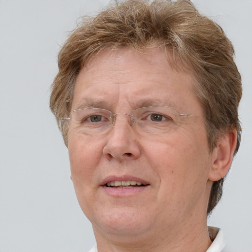 Joyful white middle-aged female with short  brown hair and grey eyes