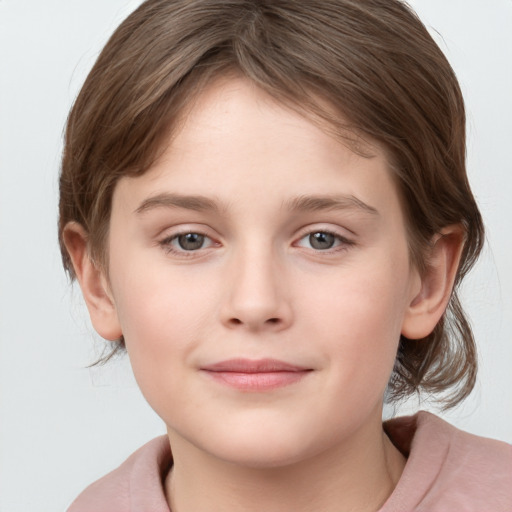 Joyful white child female with medium  brown hair and grey eyes