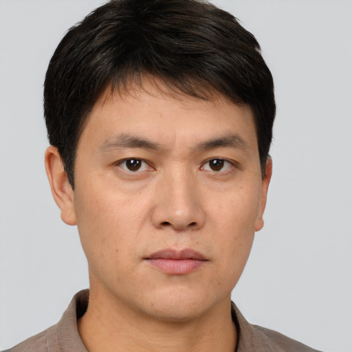 Neutral asian young-adult male with short  brown hair and brown eyes