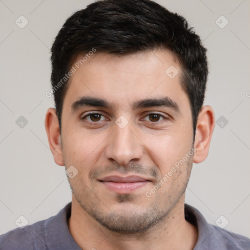 Joyful white young-adult male with short  black hair and brown eyes