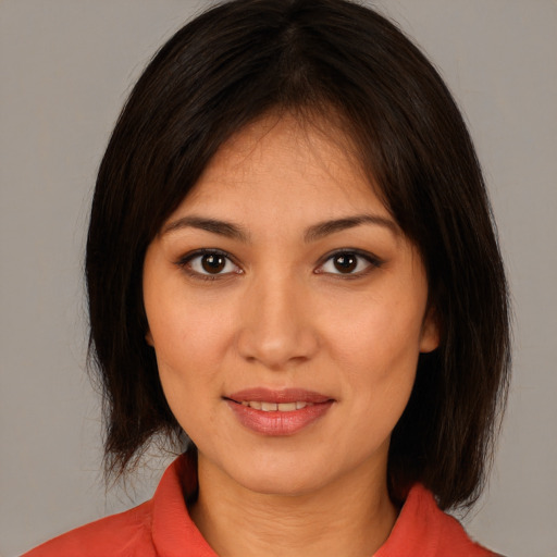 Joyful white young-adult female with medium  brown hair and brown eyes