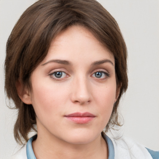 Neutral white young-adult female with medium  brown hair and grey eyes