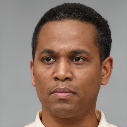 Neutral latino adult male with short  brown hair and brown eyes