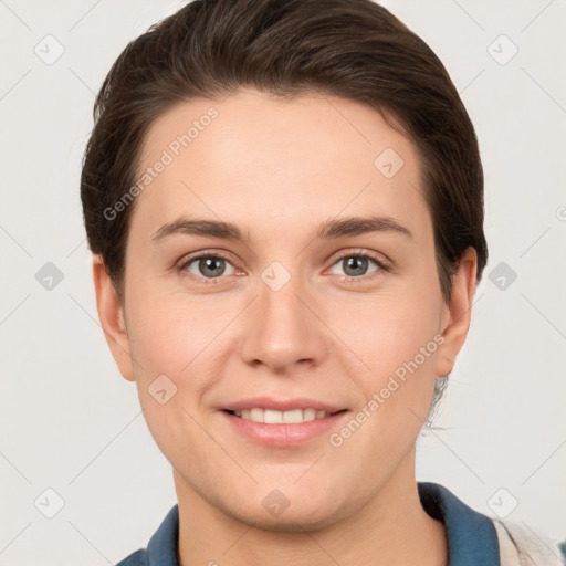 Joyful white young-adult female with short  brown hair and grey eyes