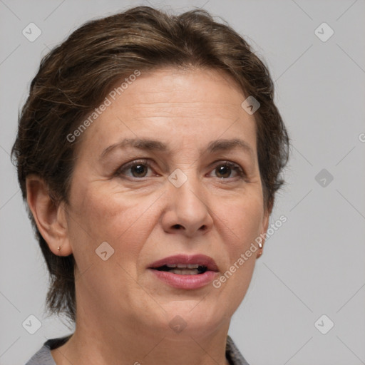 Joyful white adult female with short  brown hair and brown eyes