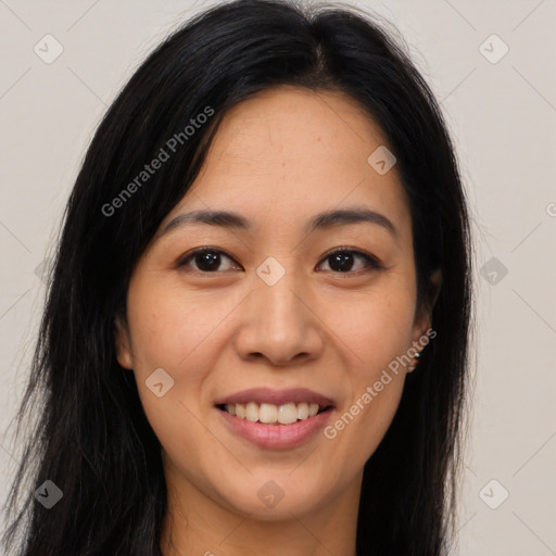 Joyful latino young-adult female with long  brown hair and brown eyes