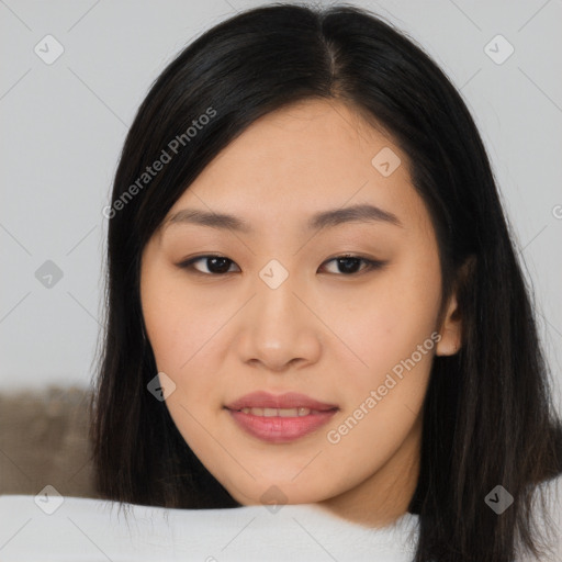 Joyful asian young-adult female with long  black hair and brown eyes