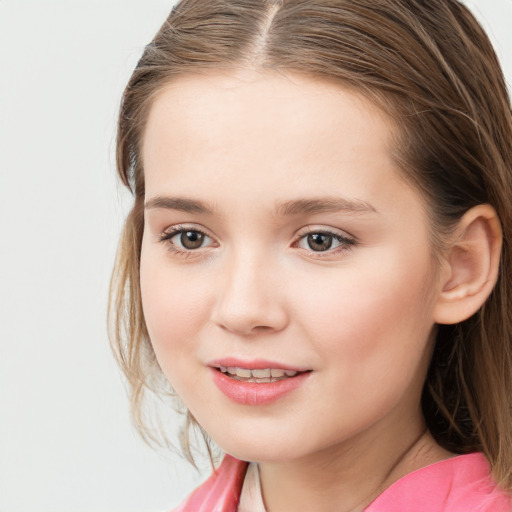 Joyful white child female with long  brown hair and brown eyes