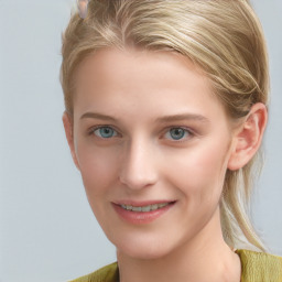 Joyful white young-adult female with medium  brown hair and blue eyes