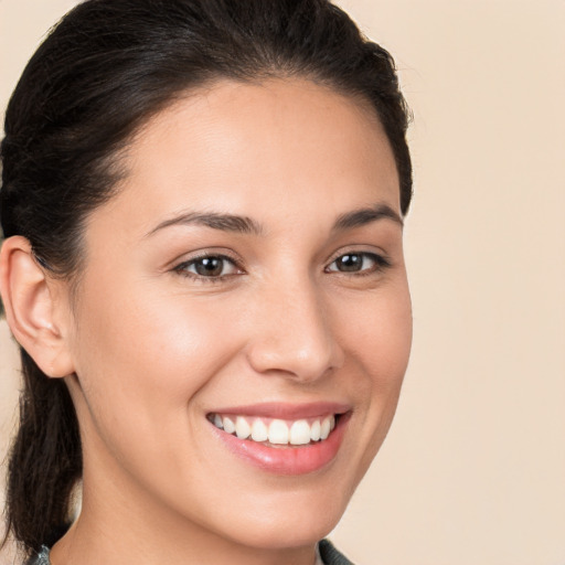 Joyful white young-adult female with medium  brown hair and brown eyes