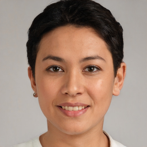 Joyful white young-adult female with short  black hair and brown eyes
