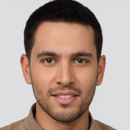 Joyful white young-adult male with short  brown hair and brown eyes