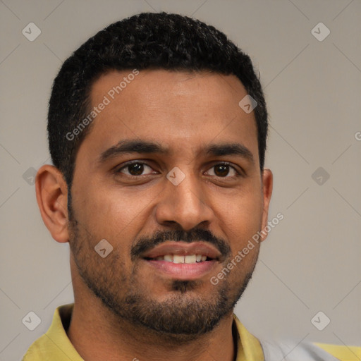 Joyful black young-adult male with short  black hair and brown eyes