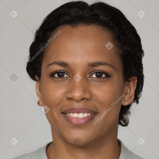 Joyful black young-adult female with short  brown hair and brown eyes