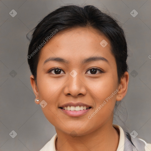 Joyful asian young-adult female with medium  brown hair and brown eyes